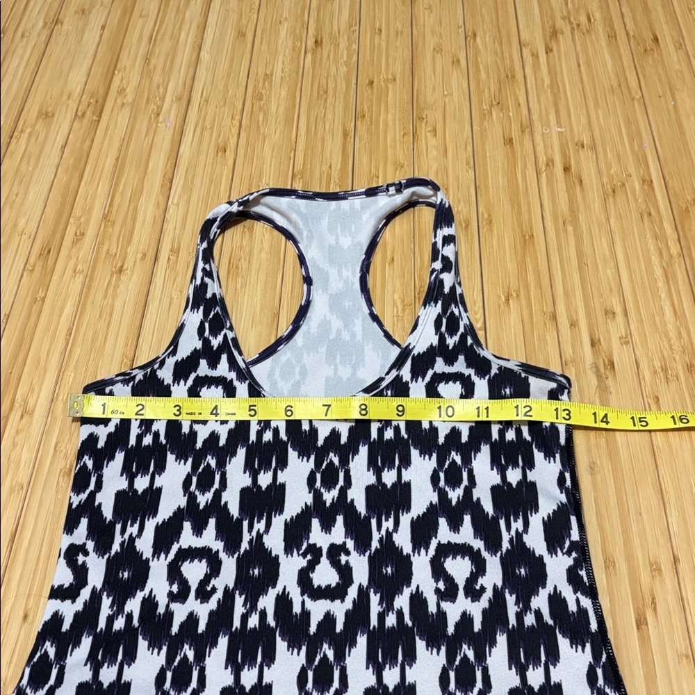 Lululemon tank top. No tag. Measures a size 4. White,black and purple. - Picture 6 of 7